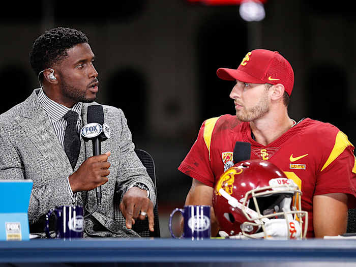 FOX Sports analyst and former USC star Reggie Bush interviews Trojans QB Matt Fink after the team's win over Utah.
